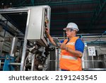 Small photo of Mechanical aintenance engineer operate shut off valve control boiler at the pressure tank during plant inoperation outage shutdown