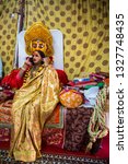 Small photo of Allahabad / India 3 February 2019 Portrait of Hijra or eunuchs or transgender hindu holy Kinnar Talking On Cell Phone at Kinnar Akhada kumbh mela in Allahabad Uttar Pradesh India