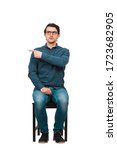 Small photo of Full length of fink guy informer pointing index finger aside, blaming someone as guilty or choosing something, isolated on white background. Frustrated nerd, business worker snitch wears glasses.