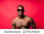 Like what you see. A handsome and muscular young man posing in a studio.