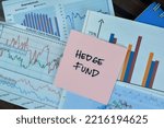 Concept of Hedge Fund write on sticky notes isolated on Wooden Table. Selective focus on hedge fund text