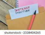 Small photo of Sentence Structure text with document brown envelope isolated on office desk
