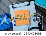 Concept of Atomic Dermatitis write on sticky notes with stethoscope isolated on Wooden Table.