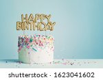 Birthday cake with gold happy birthday banner