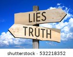 Lies, truth - wooden signpost