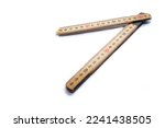 Broken wood metric folding ruler isolated on white background, space for text.