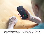 Phone call to old woman from scam or fraud caller. Elder senior answering to unknown number. Smartphone scammer or mobile hoax, catfish or phishing concept. Stalker or stranger. Grandma with cellphone