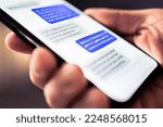 Text message in phone. Send sms with smartphone. Mobile conversation and texting in instant messaging and online chat app in cellphone. Communication in business network. Discussion in dark at night.