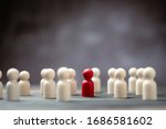Small photo of Wooden figure standing with team to show influence and empowerment. Concept of business leadership for leader team, successful competition winner and Leader with influence