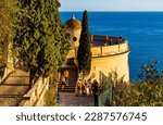 Small photo of Nice, France - July 30, 2022: Sunset view of Colline du Chateau Castle Hill and Tour Bellanda Tower in Nice over French Riviera of Mediterranean Sea