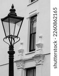 Small photo of London UK. February 2023. Northcote Mansions, Hampstead Square, in Hampstead, London, UK. Beautiful residential white painted building with architectural detail. Street lamp in foreground.
