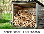 shed for storing firewood with dry firewood.