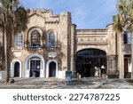 Small photo of Charleston, South Carolina, USA, February 10, 2023 -  The 1859 Old Slave Mart Museum at 6 Chalmers Street and next door 1851 Romanesque Revival engine house seen in dappled late afternoon light