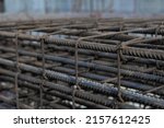 Small photo of Reinforcing steel Beam for building, Construction work. Rebar steel bars, reinforcement concrete bars with wire rod used in construction site. Using steel wire for securing steel bars with wire rod