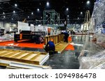 Small photo of BANGKOK,THAILAND-MAY 20 ,2018 :many carpenters tear down booth for move out from Intermach 2018 an event manufacturing machine shows in Bitec Exhibition hall Bangkok,Thailand
