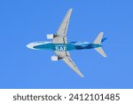 Small photo of Everett, WA, USA - January 12, 2024; Boeing 777 underside with powered by SAF Sustainable Aviation Fuel text
