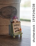 Small photo of Table sign Happy Hallo Ween on wooden floor