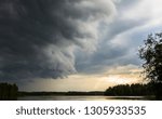 Small photo of Intense dynamic cloudscape background image - Thundercloud from below