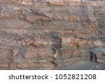 Small photo of Texture of dry natural unwrought stone with streaks