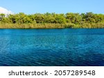 Small photo of Lake Titreyengel. A trembling lake. Sorgun. Side. The resort village of Titreyengol on the shores of a trembling lake in Turkey. The water in the lake is clear, in many places you can see algae