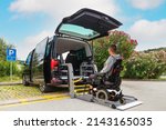 Small photo of Accessible car with wheelchair lift ramp for person with disability.