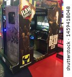 Small photo of Wisconsin, USA; July 2, 2019: A “Walking Dead” video game based on the TV series of the same name, at the Tom Foolery arcade section of the Kalahari Resort in the Wisconsin Dells.