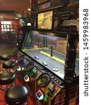 Small photo of Wisconsin, USA; July 2, 2019: A game allows players to remotely control “NASCAR” replica toy cars in a race track at the Tom Foolery arcade section of the Kalahari Resort in the Wisconsin Dells.