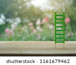 Green Pencil Ladder On Wooden...