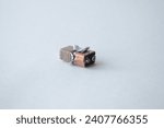 Small photo of disassembled battery 9v. One disassembled battery 9v on white background. inside the 9v battery consists of several small batteries