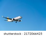 Small photo of Batumi, Georgia - May 18 2022: Close-up of a Turkish Pegasus Airlines plane landing on a blue sky background on a sunny bright day
