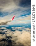 Small photo of BERGEN, NORWAY - JULY 27, 2014: Wizzair airline wing. Sky view from the airplane window. W!zz Air is Hungarian low cost airline founded in 2003.