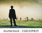 Small photo of Cowboy silhouette, at Sad Hill Cemetery in Burgos Spain. Tourist place, film location where the last sequence of the western film The Good, the Bad and the Ugly was filmed.