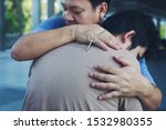 Small photo of Male people christian adult health care hug to friend team support and encourage anointed believe with cross crucifix in hand