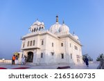 Small photo of Anandpur Sahib, Punjab, India - March 2022: Gurdwara Takht Sri Kesgarh Sahib in anandpur sahib, the birthplace of the khalsa sacred to the Sikh religion. White building architecture of sikhism.