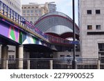 Small photo of London, UK - July 17 2016: DLR (Docklands Light Railway) train running towards Heron Quays Station in Canary Wharf, Tower Hamlets