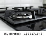 Dirty black glass kitchen stove in home kitchen.