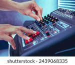 Small photo of Sound engineer hands adjusting control sound mixer in recording, broadcasting studio,Sound mixer. Professional audio mixing console, buttons, faders and sliders. sound check.