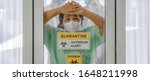 Small photo of coronavirus covid 19 infected patient in coronavirus covid 19 quarantine room with quarantine and outbreak alert sign at hospital with blurred disease control experts, coronavirus outbreak control