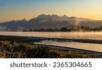 Small photo of Early morning fog covering Pitt River and Golden Ears Mountain. View from Port Coquitlam Trail, BC, Canada.