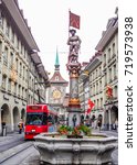 Small photo of Bern, Switzerland - June 25, 2012: Beautiful City Street View of the colorful medieval Marksman statue on the fountain in Bern, Switzerland. The fountain is attributed to Hans Gieng in 16th century.