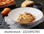Small photo of Pasta Carbonara - Italian pasta dish, traditionally done with only 4 ingredients - parmesan cheese, guanciale or pancetta, eggs and black pepper.