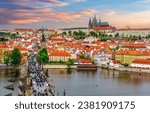 Small photo of Prague cityscape with Charles Bridge over Vltava river and Hradcany castle at sunset, Czech Republic