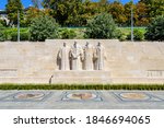 Small photo of Geneva, Switzerland - September 5, 2020: Front view of the four statues at the center of the Reformation Wall, in the Parc des Bastions, representing the Calvinism's main proponents, on a sunny day.