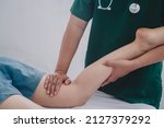 Small photo of Treating thigh pain due to sitting for long periods of time Concept of physical rehabilitation. Consultation therapist with the treatment of treating injured thigh pain in modern clinics.