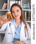 Small photo of Beautiful smiling female doctor hold in arms pill bottle and offer it to visitor portrait. Panacea or life save antidepressant from legal store prescribe vitamin medic aid for healthy lifestyle