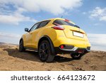 Small photo of RUSSIA, MAGNITOGORSK - August twenty-ninth , Sixteenth year : Yellow off-road car nissan juke outside the city. test drive