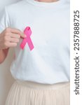 Small photo of Pink October Breast Cancer Awareness month, woman with pink Ribbon in hospital for support people life and illness. National cancer survivors month, Mother and World cancer day concept