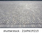 Textured chevron background pattern herringbone brick tile floor walkway or patio