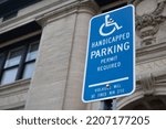 Street sign symbol handicap  Parking Permit Required Violators Will Be Fined Min $150