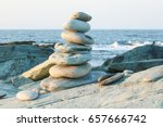 A balanced rock stack in front of the ocean.. Rock balancing is a type of problem solving, and some artists consider it as a skill in awareness and meditation. Patience, serenity, reflection, mindful 